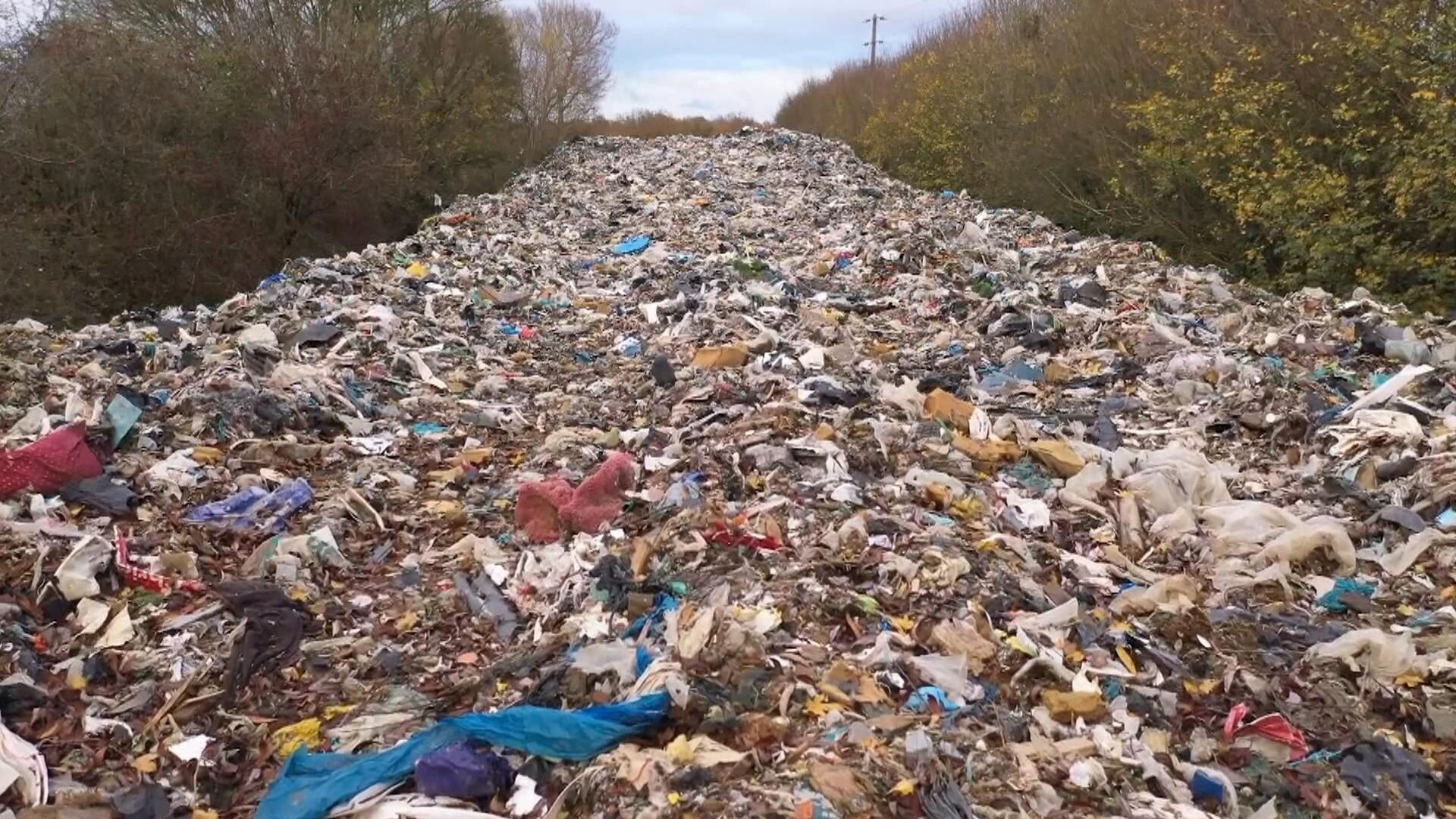 Drone footage shows scale of 'revolting' 60m-long mountain of waste next to river